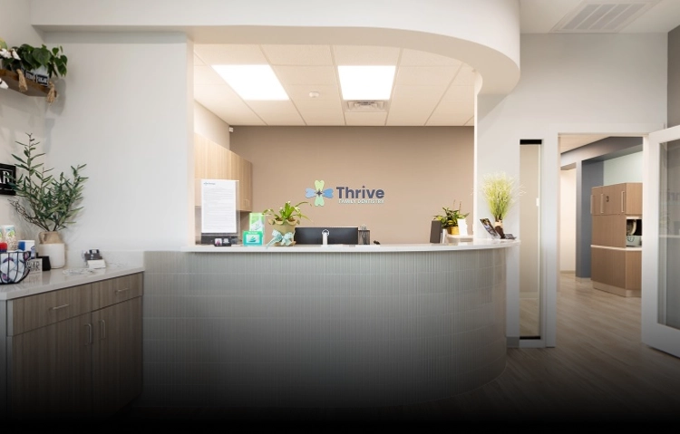 Modern reception area at Thrive Family Dentistry of Auburn, showcasing a clean and welcoming front desk in a dentist Auburn office